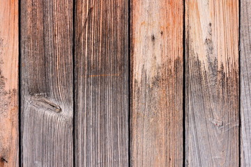  Teak wood texture background. Wooden door composed of vertical teak planks with tongue and groove joints. After years in exposed condition the planks shown interesting texture.
