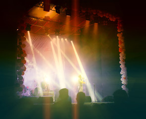 Groups of Fans on the Scene During the Concert.