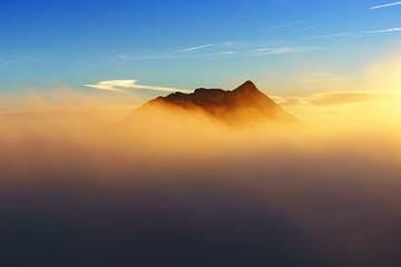 Fototapeta na wymiar Anboto mountain peak surrounding by fog