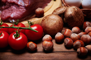 Close view at nuts, cherries and mushrooms