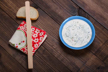 Close-up of russian cold vegetable soup on yogurt, sour-milk base - okroshka
