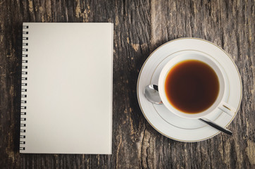 Obraz na płótnie Canvas White notebook and cup of tea