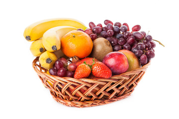 Fruits  in the basket. assorted fruits in wicker basket
