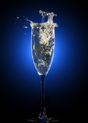 Glass of champagne with splashes