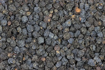 getrocknete Aroniabeeren als Hintergrundbild