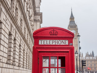 Fototapeta na wymiar Traditional British phone booth with Big Ben in background - 8