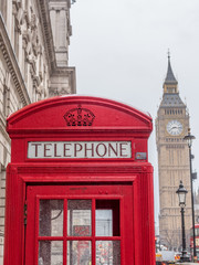 Fototapeta na wymiar Traditional British phone booth with Big Ben in background - 9