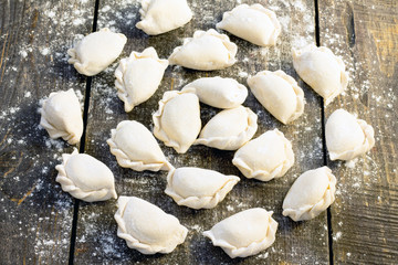 Raw dumplings with potatoes, selective focus.