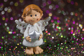 Little Christmas angel with a silver star.