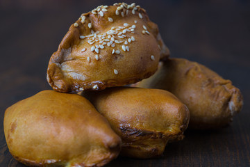 empanadas - Argentine fried meat pies.wooden background