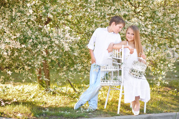 Fototapeta premium Portrait of a boy and girl in summer