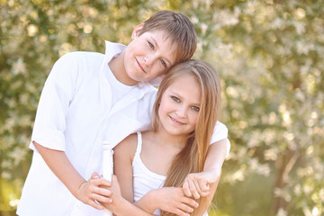 Fototapeta premium Portrait of a boy and girl in summer