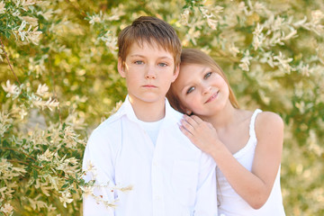 Fototapeta premium Portrait of a boy and girl in summer
