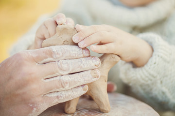Teacher and kid potters at workshop © A.Kazak