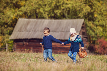 Brother and sister play together outdoor