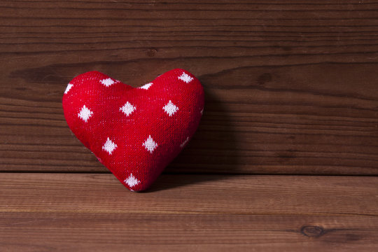 cloth heart on wooden background