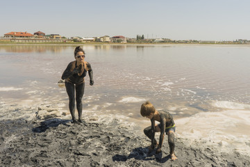 Mom and boy on the therapeutic mud
