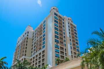 Luxury resort building at Sarasota Bay in Florida USA. Architectural residential condominiums for holidays and vacation against blue sky background - 97903433