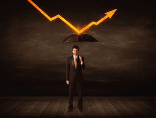 Businessman standing with umbrella keeping orange arrow