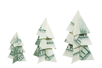 Christmas trees made of hundred dollar bills on a white background