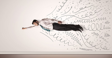 Business man flying with hand drawn lines comming out