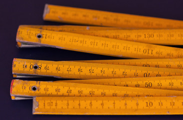 Old yellow rulers with sections