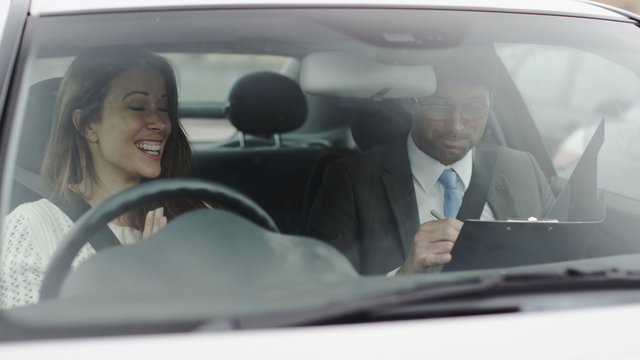  attractive young women passes her driving test.
