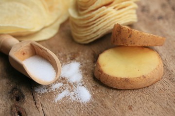 Fototapeta na wymiar fresh potatoes with potato chips