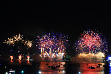 fireworks at the sea and city on background