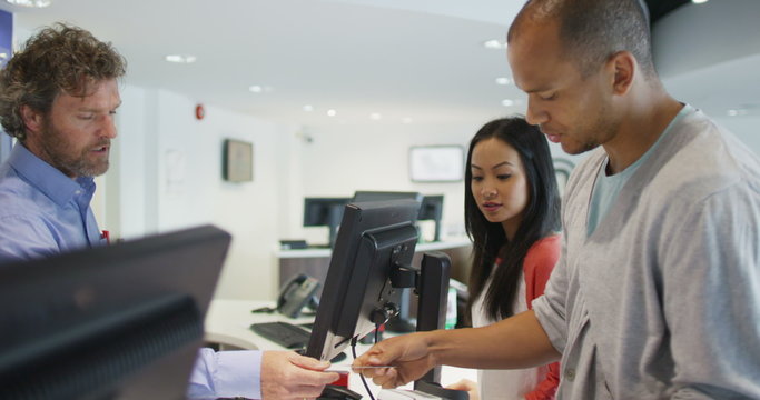 Couple shopping in consumer electronics store showroom