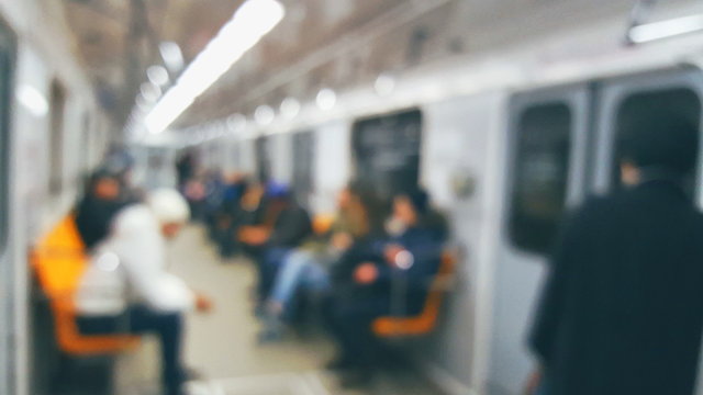 People in the car subway train in motion with blurred background