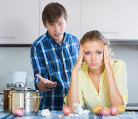 man and frustrated housewife having bad argument