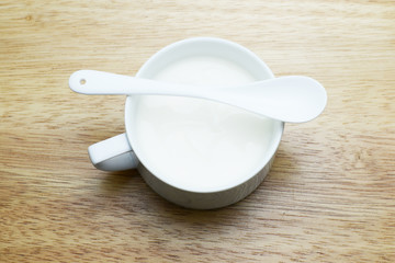 strawberry and yogurt on wood table