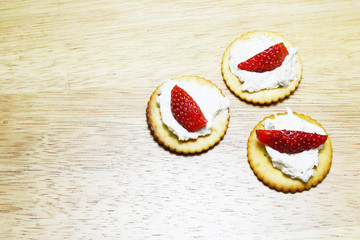 spread tuna and strawberry on biscuit 