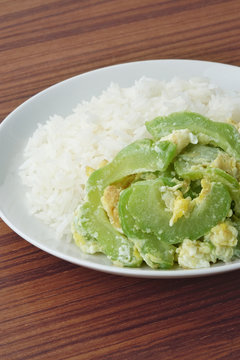 Stir fried bitter gourd with egg on rice