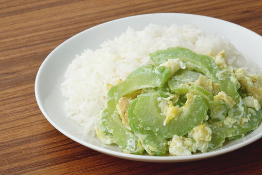 Stir fried bitter gourd with egg on rice