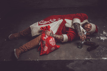 Drunk man in santa's clothes.