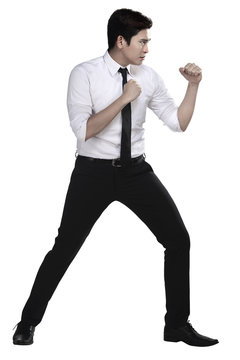 Man in white shirt doing fighting stance