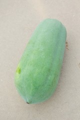 green papaya on wood plank