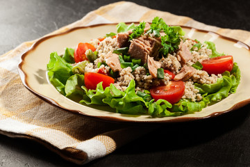 Tasty salad with couscous, tuna and vegetables