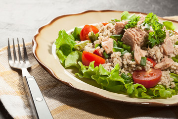 Tasty salad with couscous, tuna and vegetables