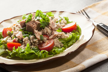 Tasty salad with couscous, tuna and vegetables