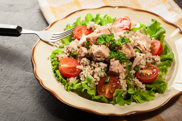 Tasty salad with couscous, tuna and vegetables