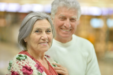 senior couple in  shopping center