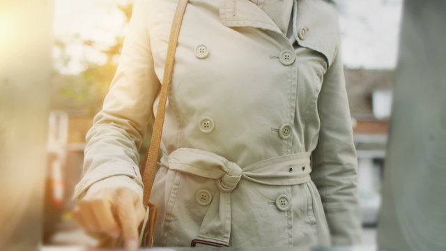 Woman taking money from ATM machine