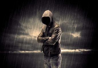 Anonymous terrorist in hoodie at night