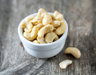 cashew nuts on wooden surface