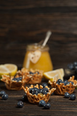  waffle baskets stuffed with lemon cream with blueberries.