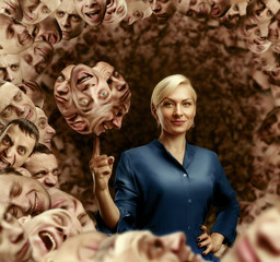 Woman holding men's faces 
