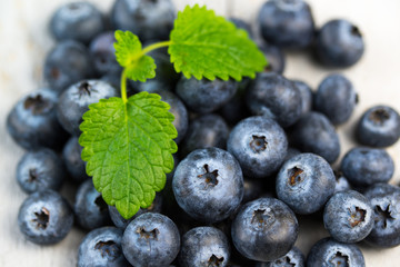 Blueberries and mint leaves close up